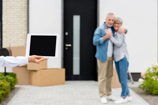 Selective Focus Broker Holding Digital Tablet Couple Standing New House — Stock Photo, Image