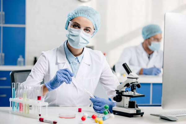 selective focus of genetic consultant doing dna test in lab 