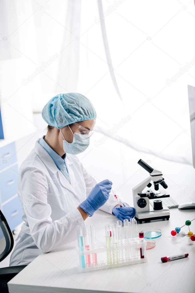 side view of genetic consultant doing dna test in lab 