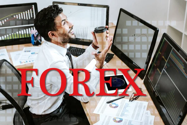 Happy Racial Trader Holding Paper Cup Sitting Computers Forex Letters — Stock Photo, Image