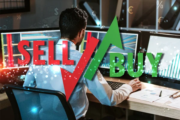 Back View Trader Working Computer Graphs Sell Buy Letters — Stock Photo, Image