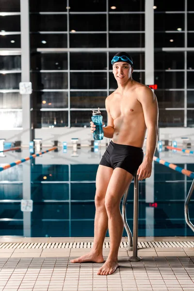 Happy Swimmer Standing Holding Sports Bottle — Stock Photo, Image