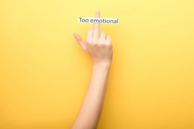 cropped view of woman showing middle finger with card too emotional isolated on yellow clipart