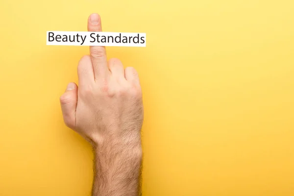 Cropped View Man Showing Middle Finger Card Beauty Standards Lettering — Stock Photo, Image