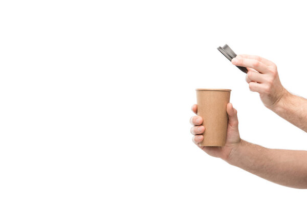 cropped view of man holding paper cup isolated on white