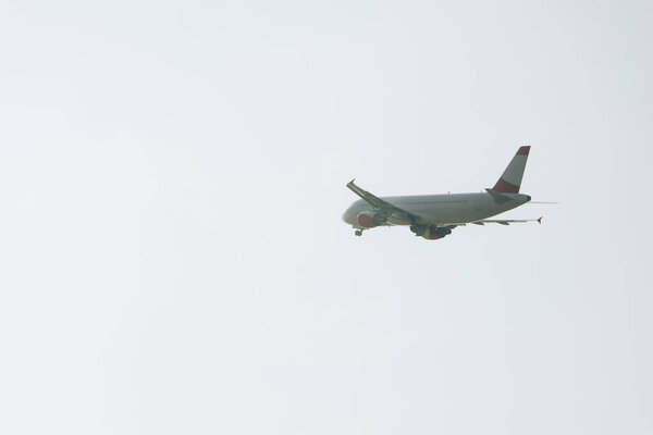 Low angle view of flight departure of airplane with sky at background