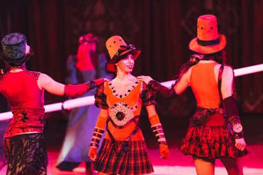 KYIV, UKRAINE - NOVEMBER 1, 2019: Artists in costumes performing at circus arena clipart