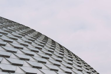 Low angle view of geometric pattern on roof of building clipart