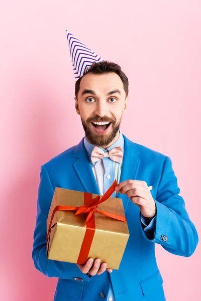 Excited Businessman Suit Holding Present Pink — Stock Photo, Image