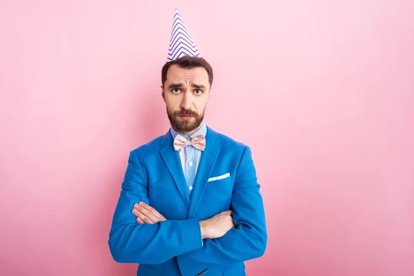 Offended Businessman Party Cap Standing Crossed Arms Pink — Stock Photo, Image