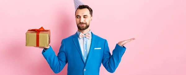 Panoramic Shot Bearded Businessman Pointing Hand Looking Present Pink — 스톡 사진