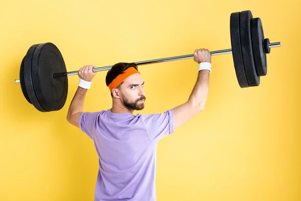 Angry Bearded Man Working Out Barbell Isolated Yellow — Stock Photo, Image