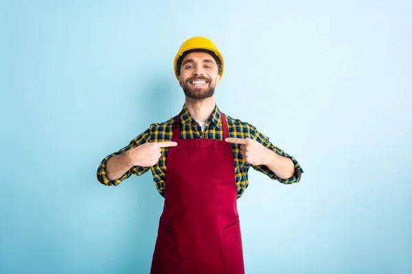 Cheerful Workman Pointing Fingers Blue — Stock Photo, Image