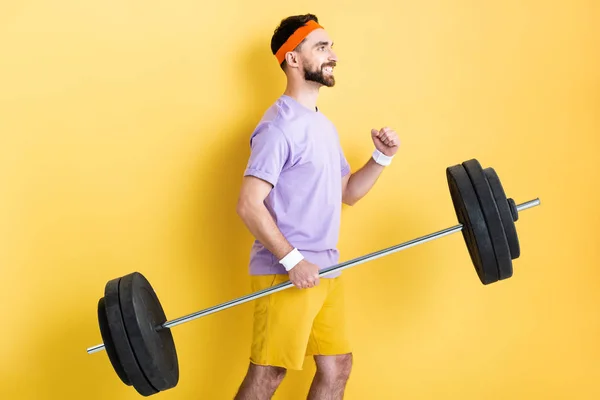 Side View Happy Sportsman Holding Heavy Barbell Yellow — 스톡 사진
