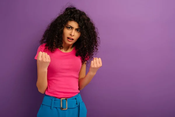 Angry Racial Girl Showing Fists While Looking Camera Purple Background — Stock Photo, Image