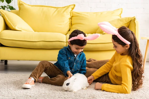 Adorable Kids Bunny Ears Playing White Rabbit While Sitting Floor — Stock Photo, Image