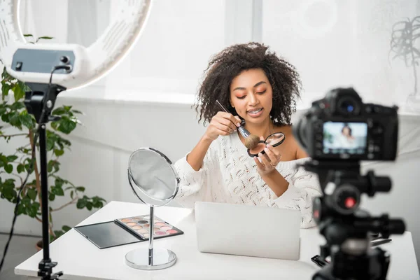 Selective Focus Happy African American Video Blogger Braces Holding Cosmetic — Stock Photo, Image