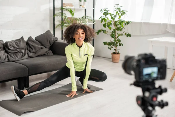 Selective Focus Sportive African American Video Blogger Braces Stretching Digital — Stock Photo, Image