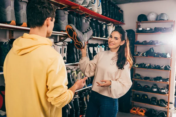 Smiling Worker Showing Ski Boot Client Repair Shop — 스톡 사진