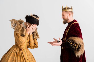 queen and king with crowns quarreling isolated on grey 