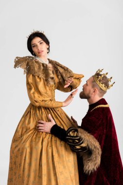 king asking for forgiveness queen in crown isolated on grey 