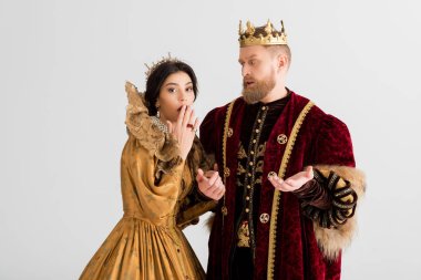 shocked queen and king with crowns isolated on grey