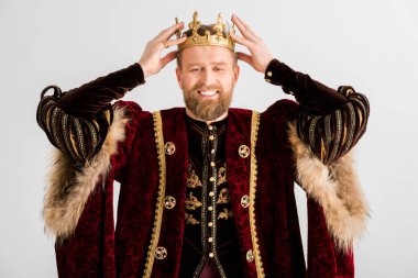 smiling king wearing crown on head isolated on grey clipart