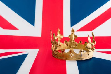 golden crown on british flag with copy space clipart