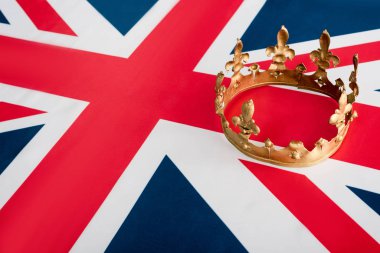 high angle view of golden crown on british flag 