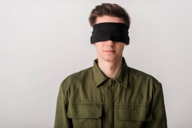 young blindfolded man isolated on white, human rights concept  clipart