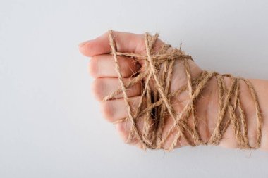 cropped view of woman with tied hand isolated on white, human rights concept  clipart