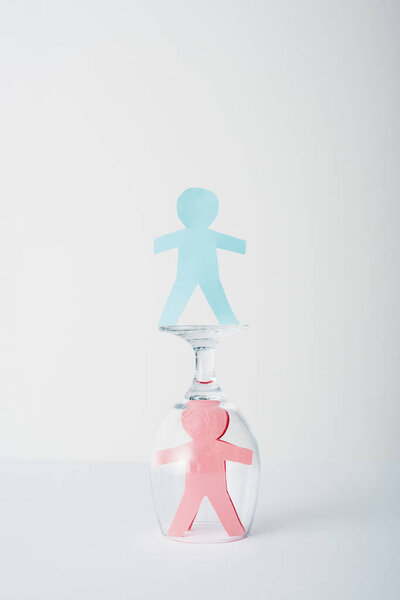 paper cut of gender equality near glass on white, sexual equality concept 