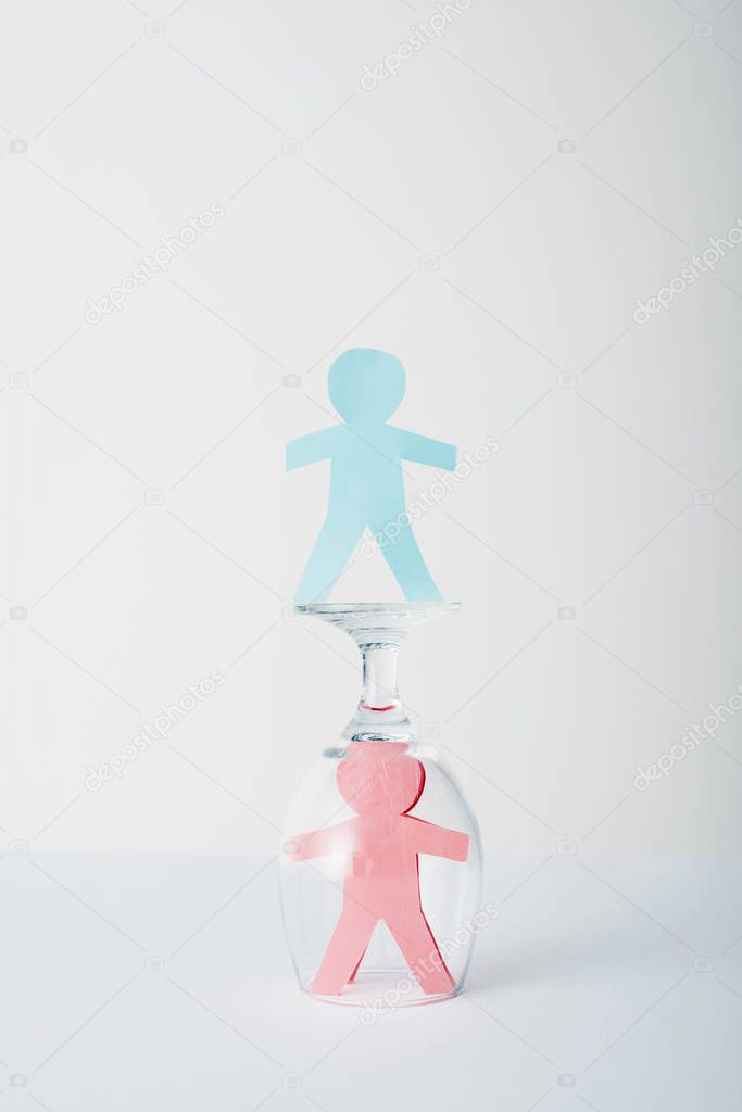 paper cut of gender equality near glass on white, sexual equality concept 