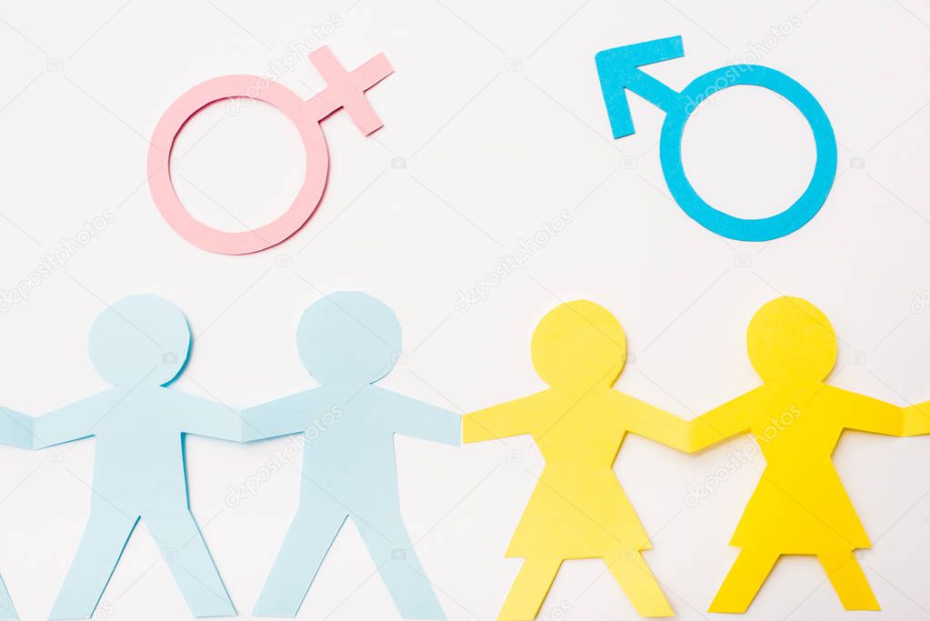 top view of paper cut people near gender signs isolated on white, sexual equality concept 