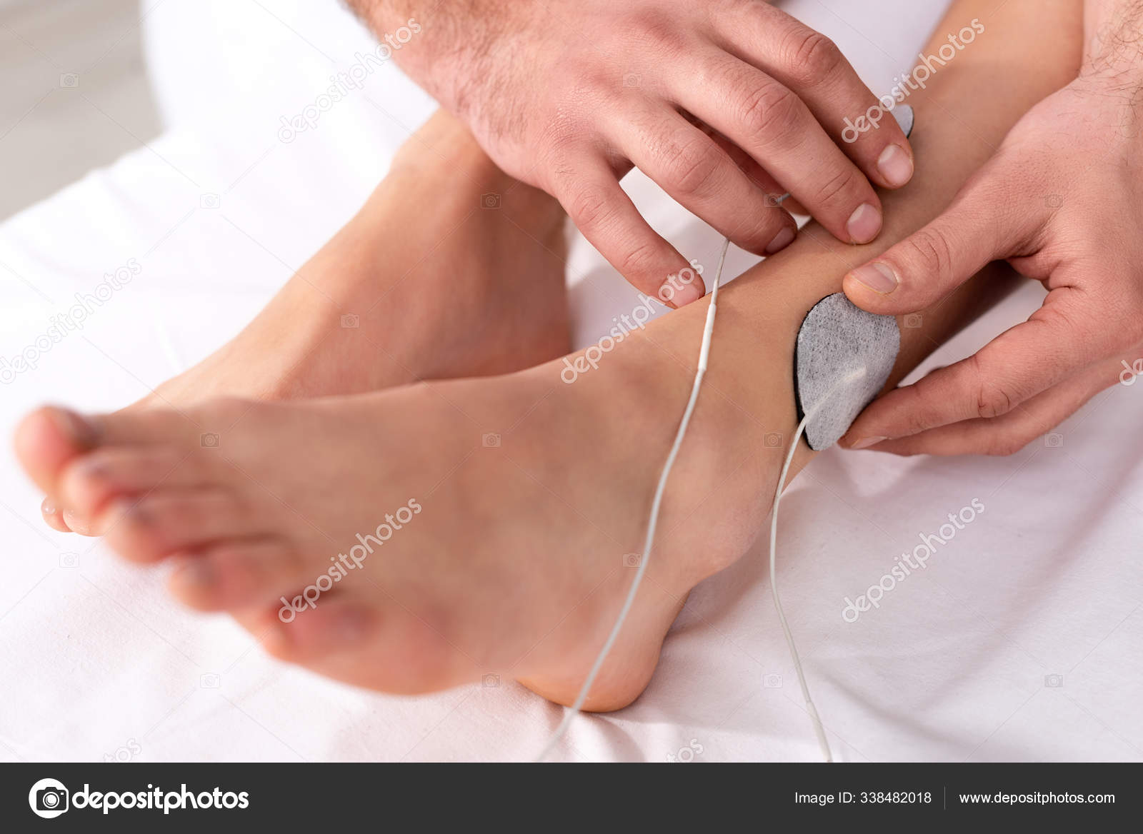 Cropped View Doctor Setting Electrodes Patient Leg Electrode Treatment Stock Photo by