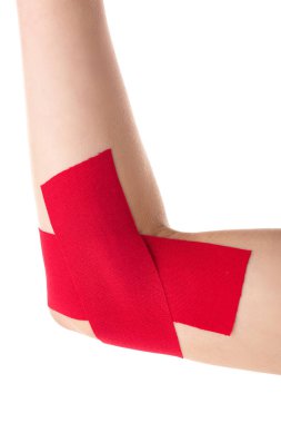 Cropped view of female cubit with kinesiology tapes isolated on white clipart