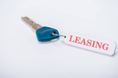 key with leasing lettering on white with copy space