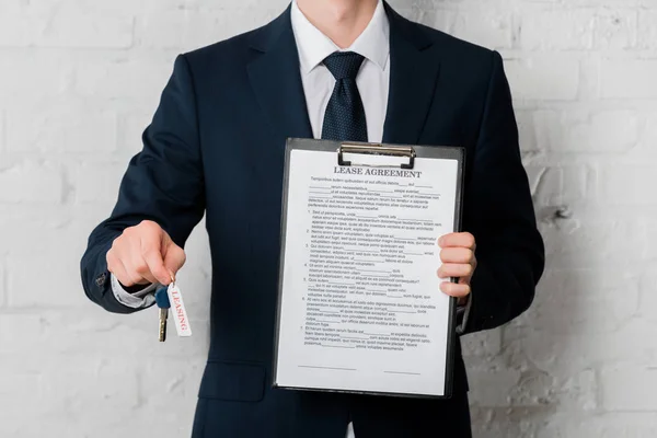 Cropped View Realtor Suit Holding Key Leasing Lettering Clipboard Lease — Stock Photo, Image