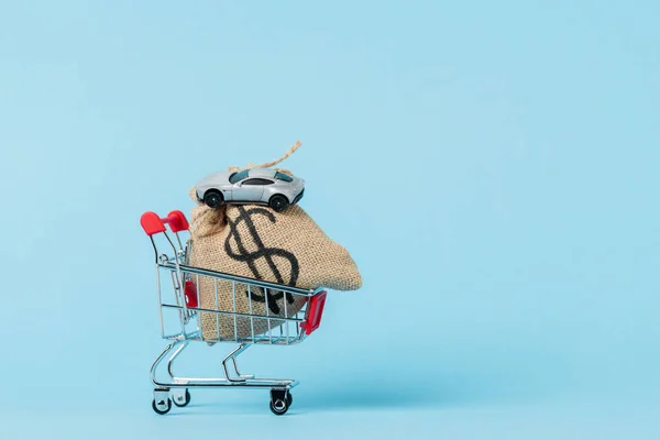 Little Shopping Trolley Dollar Bag Toy Car Blue Leasing Concept — 스톡 사진