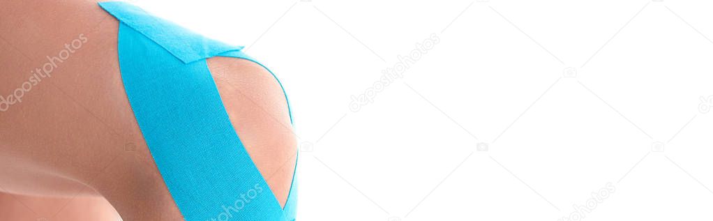 Cropped view of kinesiology tapes on knee of woman isolated on white, panoramic shot