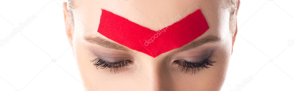 Cropped view of young woman with kinesiology tapes on forehead isolated on white, panoramic shot