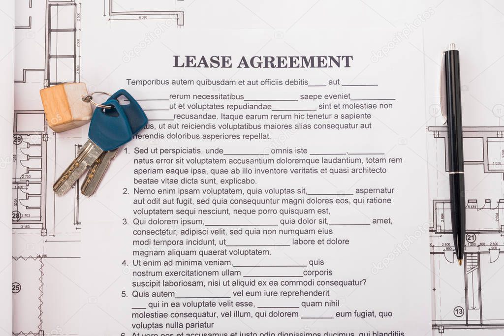 top view of document with lease agreement lettering near blueprints, pen and keys on desk 