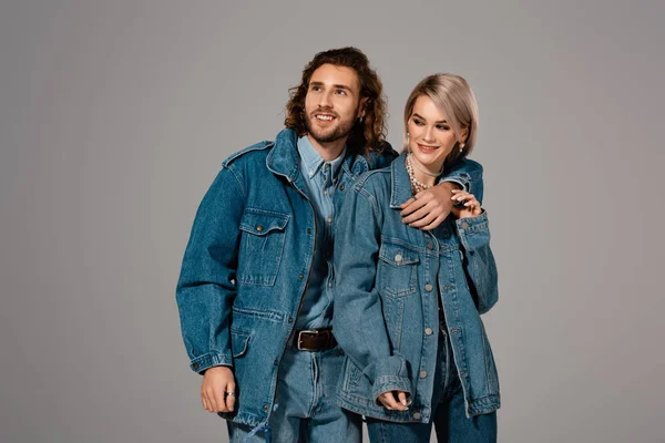 Smiling Man Hugging Woman Denim Jacket Isolated Grey — 스톡 사진
