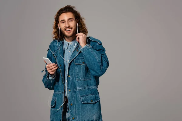 Smiling Man Denim Jacket Holding Smartphone Listening Music Isolated Grey — 스톡 사진