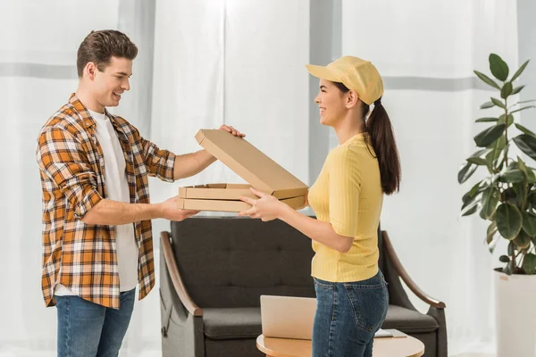 Side View Smiling Courier Giving Pizza Boxes Man Home — Stock Photo, Image