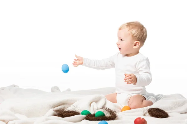 Child Throwing Easter Egg While Sitting Blanket Isolated White — Stock Photo, Image