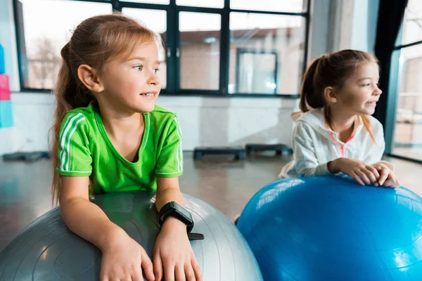 Selective Focus Children Looking Away Smiling Leaning Fitness Balls Gym — Stock Photo, Image