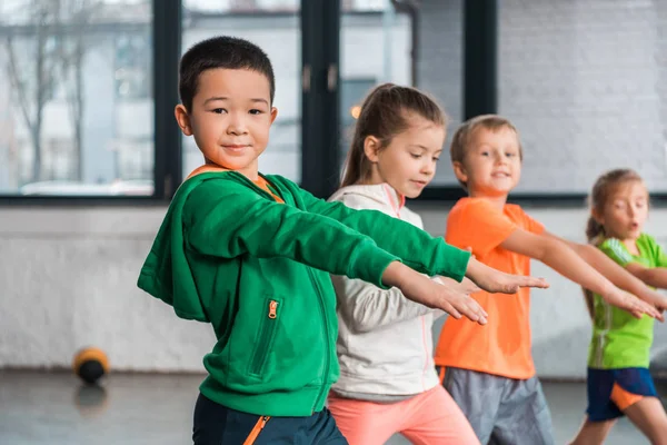 Selective Focus Multicultural Children Outstretched Hands Doing Exercise Gym — Stock Photo, Image