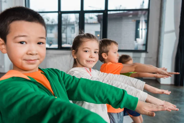 Multicultural Children Outstretched Hands Looking Camera Gym — Stock Photo, Image