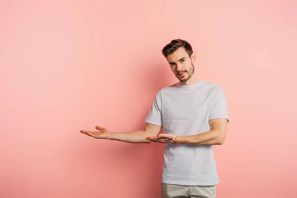 Handsome Confident Man Pointing Hands Looking Camera Pink Background — Stock Photo, Image